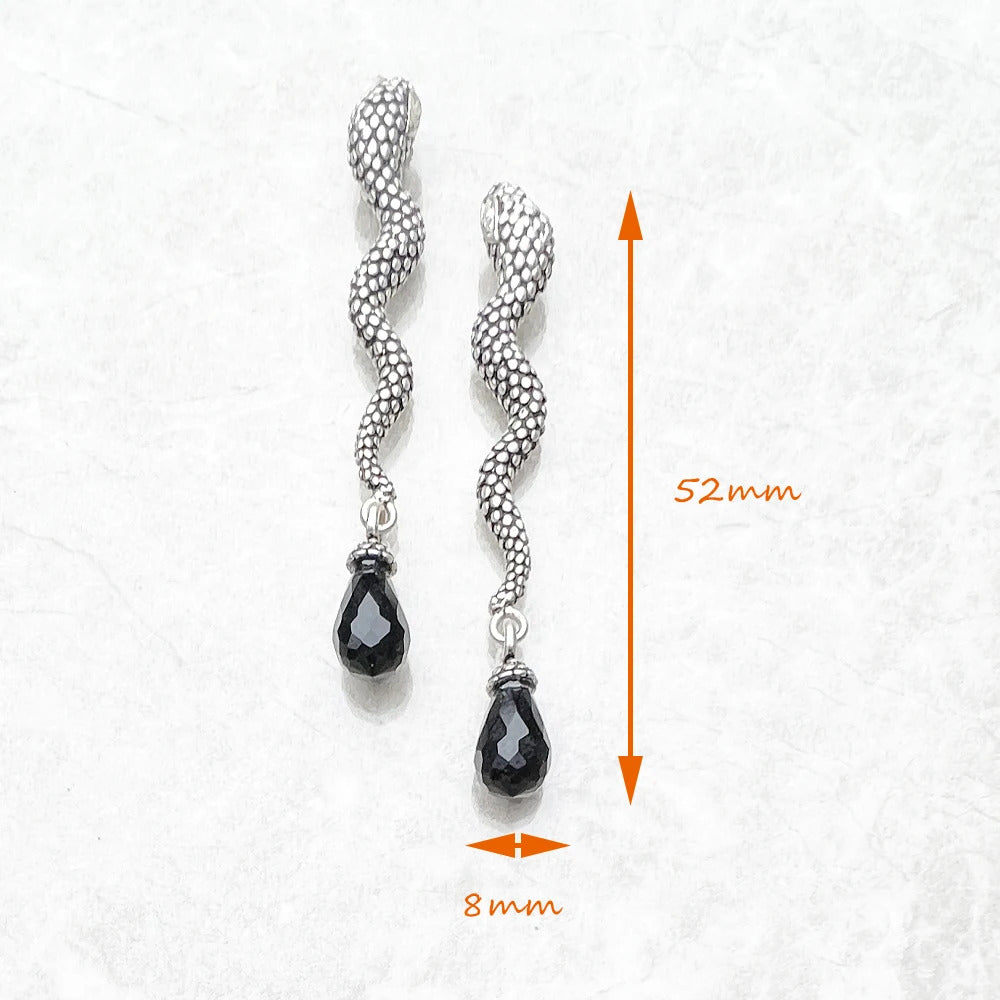 The Snake & Crystal Drop Earrings you're referring to seem to combine bold, fashionable design with a touch of glamour and sophistication. Here's an overview of their features based on the description: