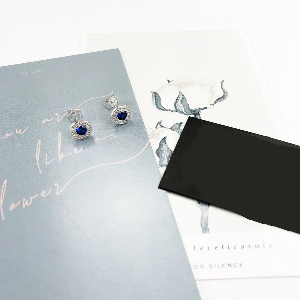 The Light of Luna Blue Ear Studs Earrings you're referring to seem to combine elegance with a touch of celestial charm. Here's a breakdown of what they might offer based on the description: